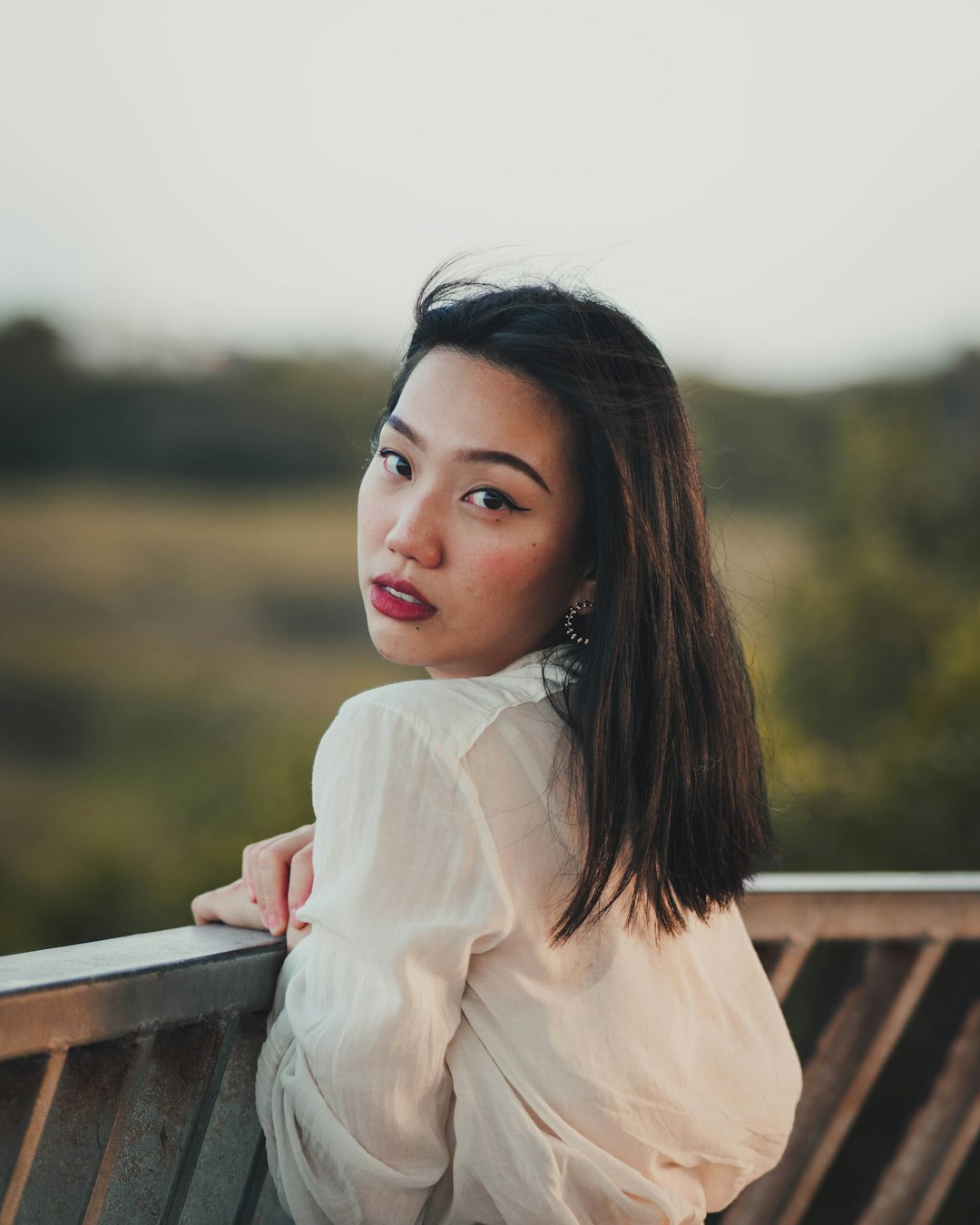 woman in white long sleeve shirt