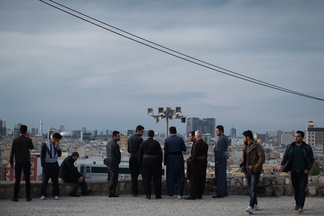 people standing on gray concrete floor during daytime