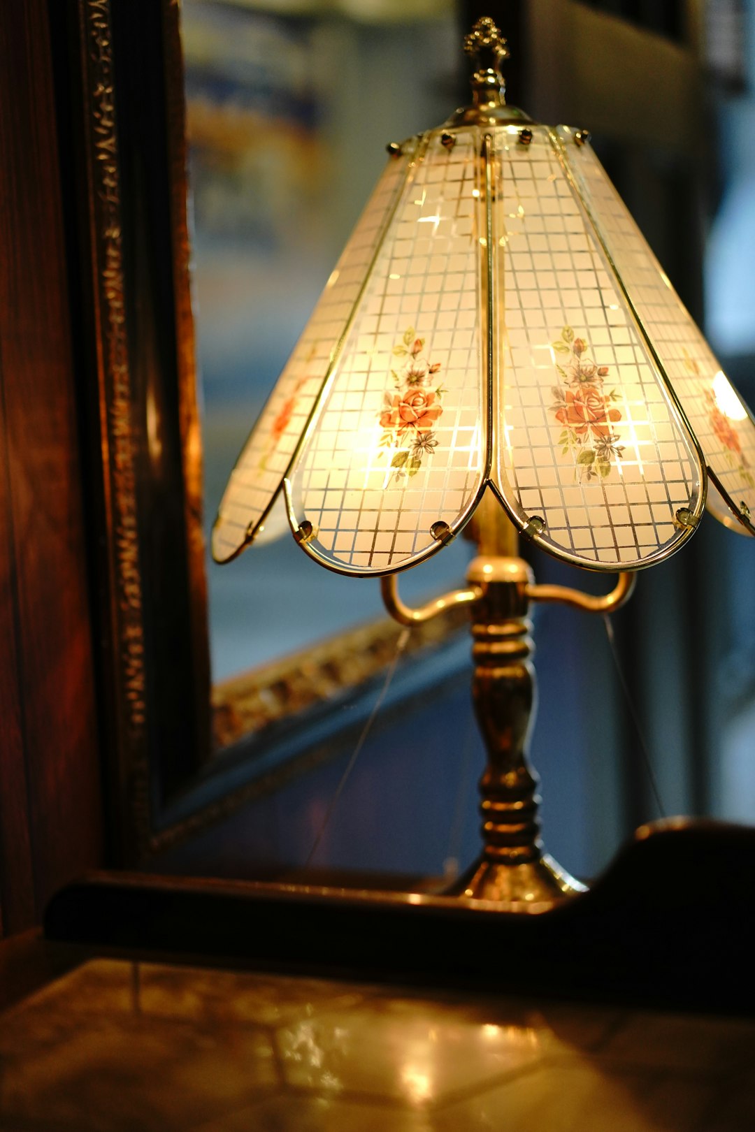 brown wooden stand with white lamp shade