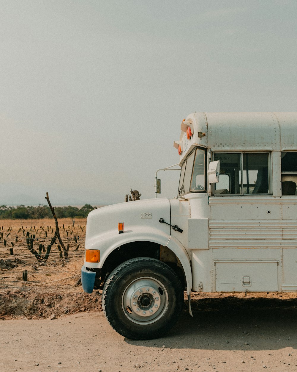 white truck on brown field during daytime