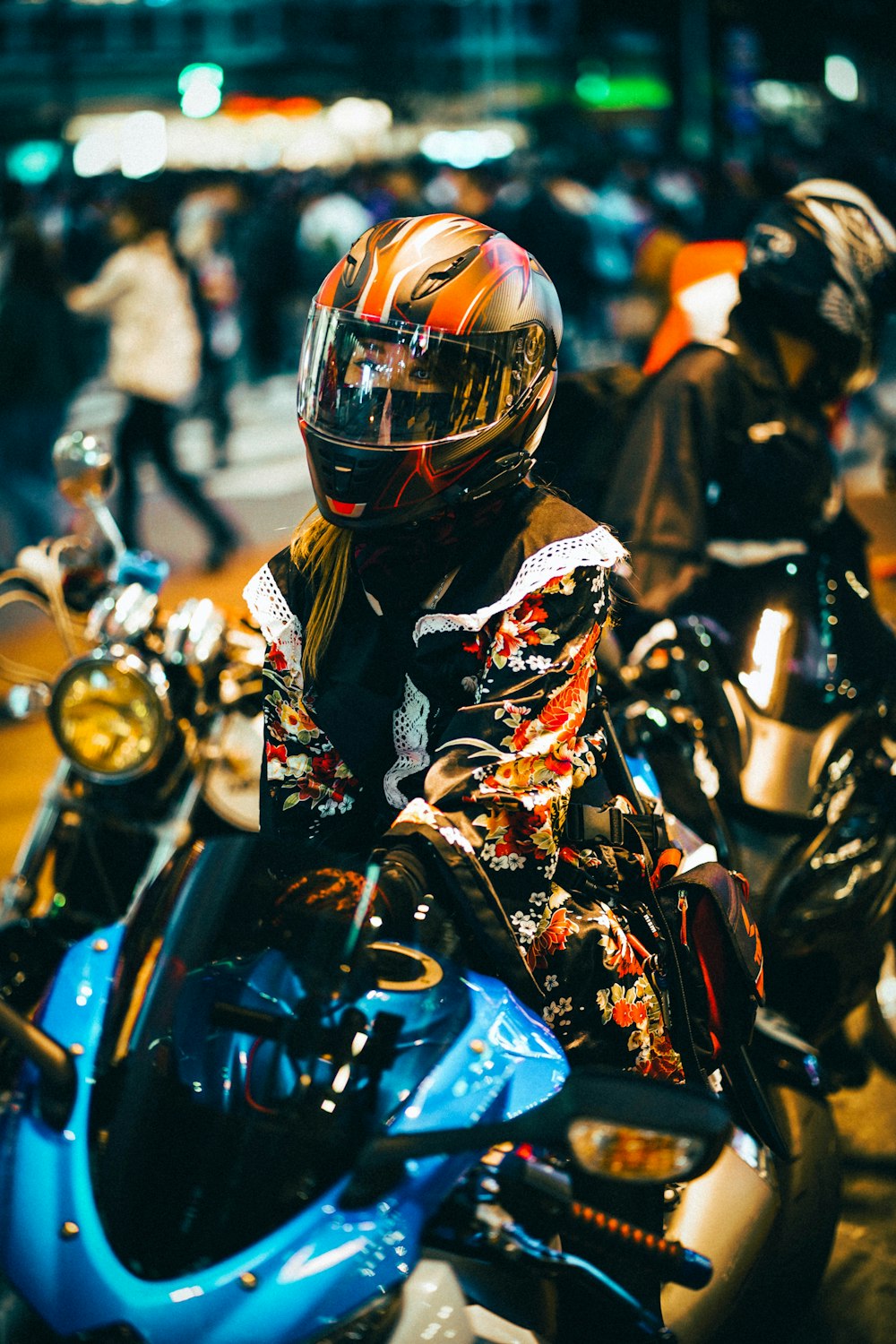 man in black and yellow motorcycle suit riding motorcycle