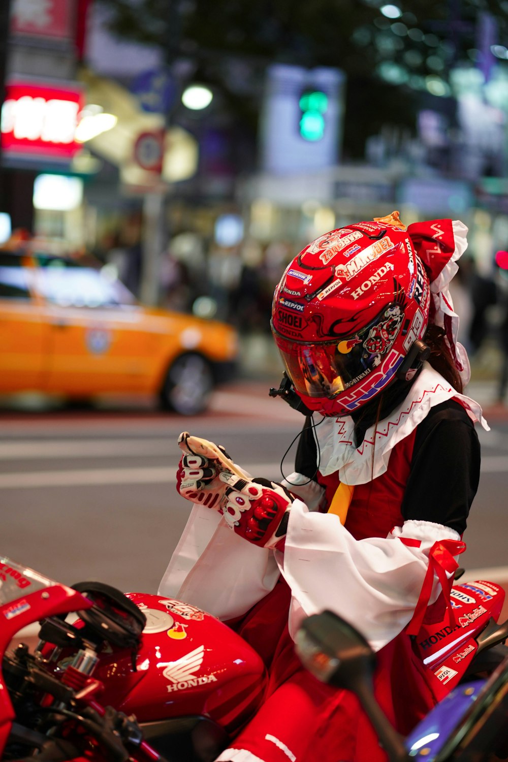 man in white and red helmet riding on red and white sports bike during daytime