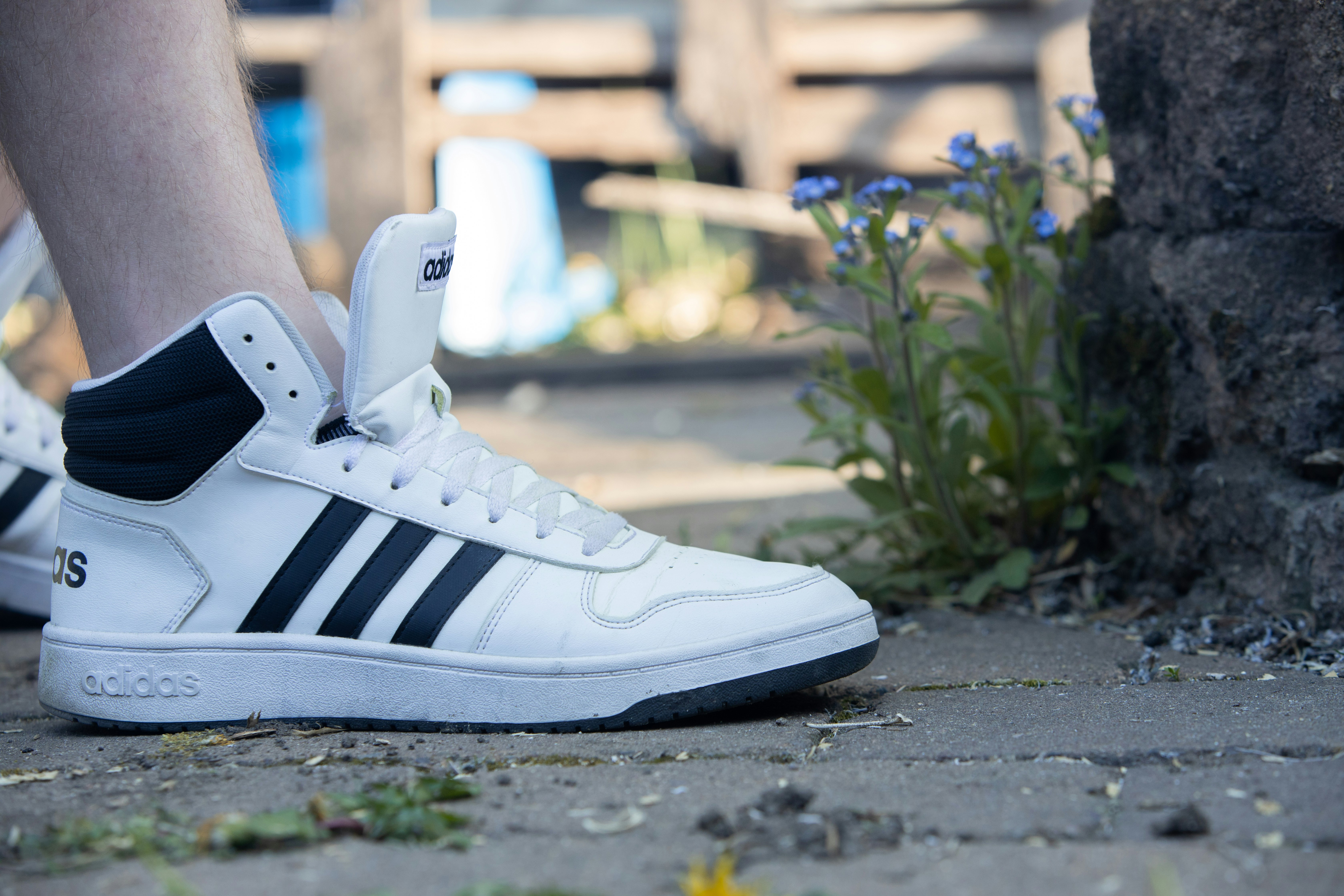 white and black adidas high top sneakers