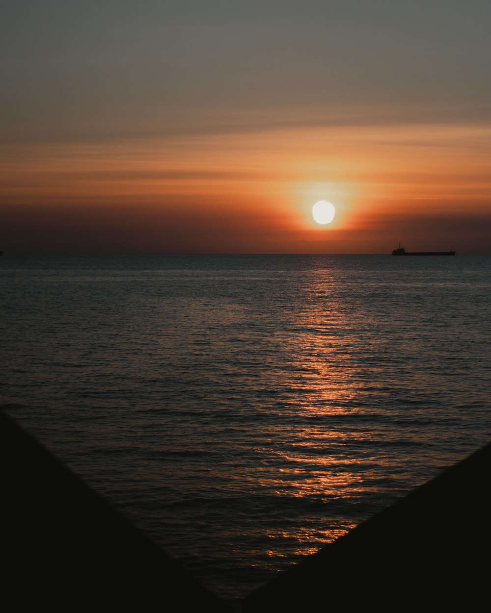 body of water during sunset