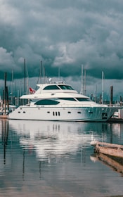 white boat on dock during daytime