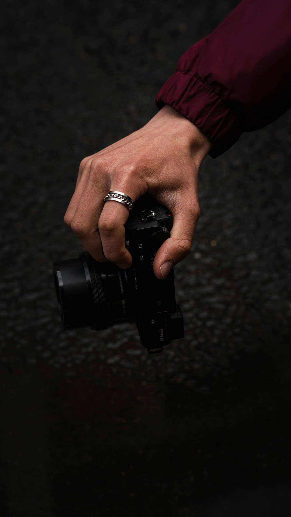 person holding black dslr camera