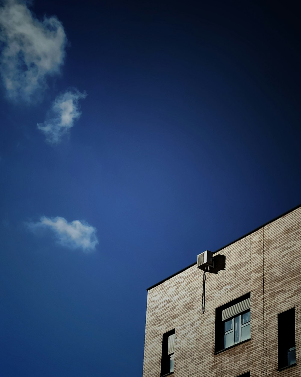 brown concrete building under blue sky during daytime