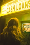 a woman standing in front of a casino sign