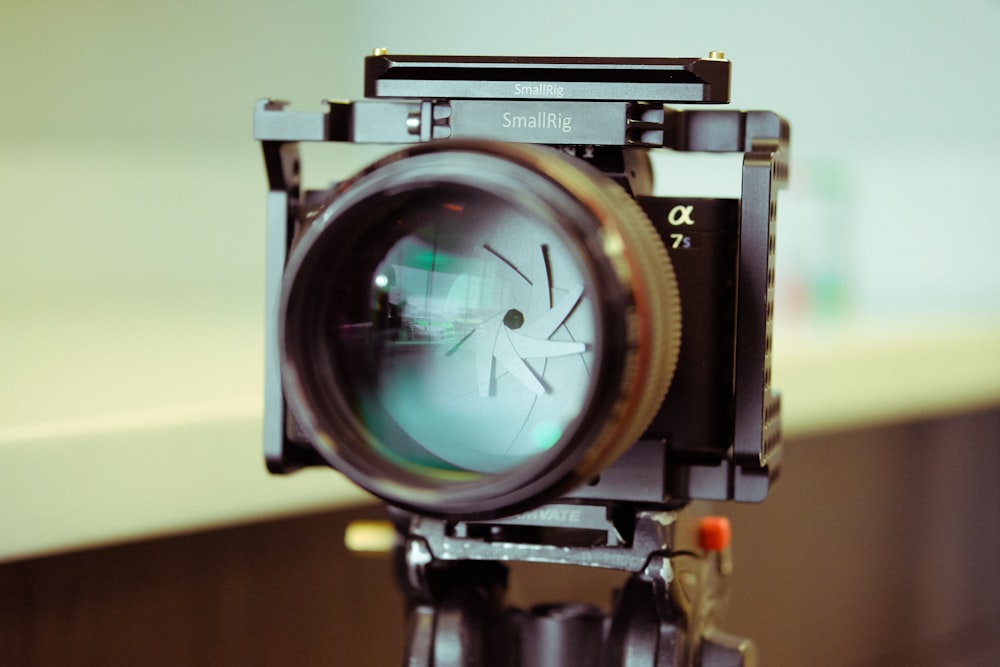 black and silver camera on brown wooden table