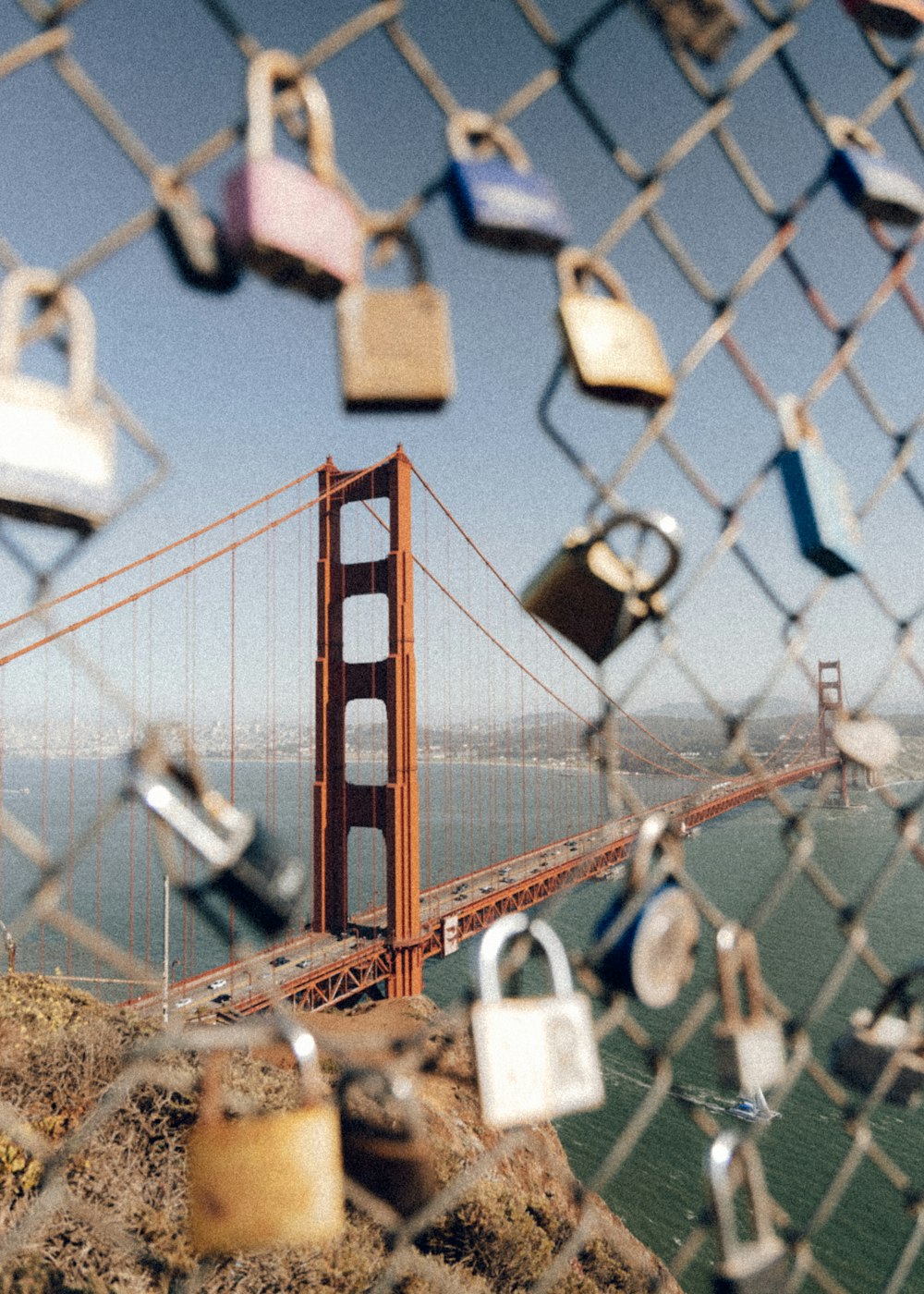 padlock on red metal fence