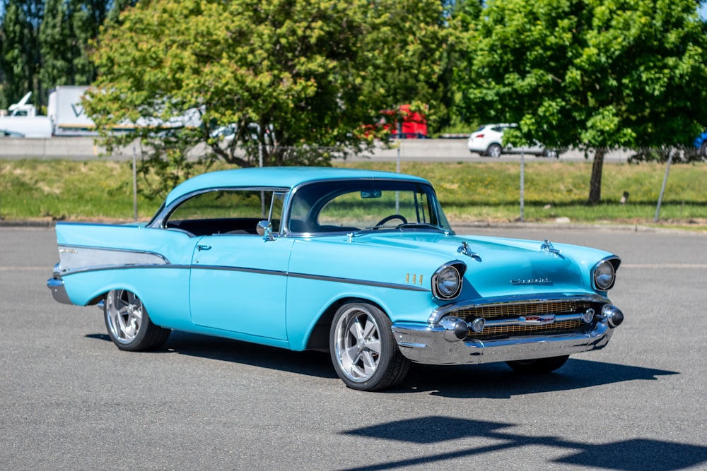 blue classic car on road during daytime