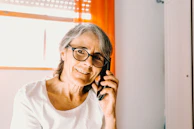 A friendly insurance agent assisting a customer over the phone.