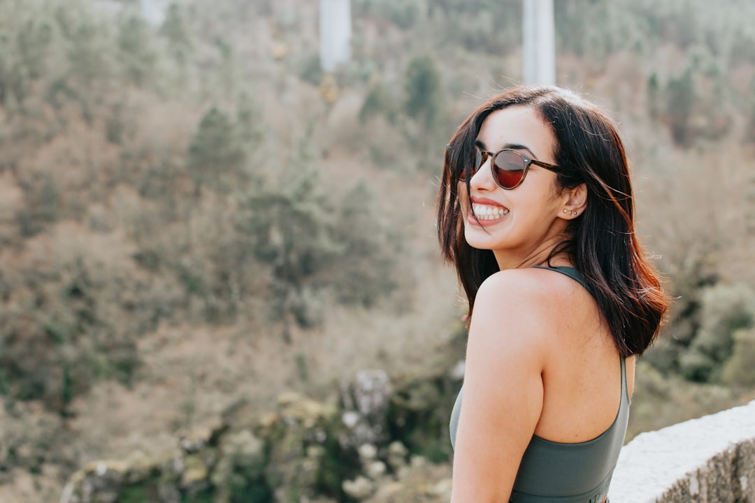 woman in black tank top wearing black sunglasses