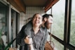man and woman sitting on chair