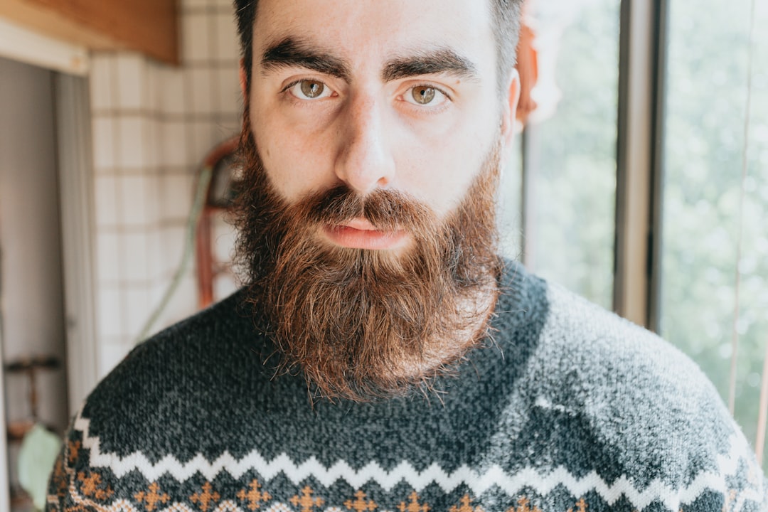 man in gray and white sweater