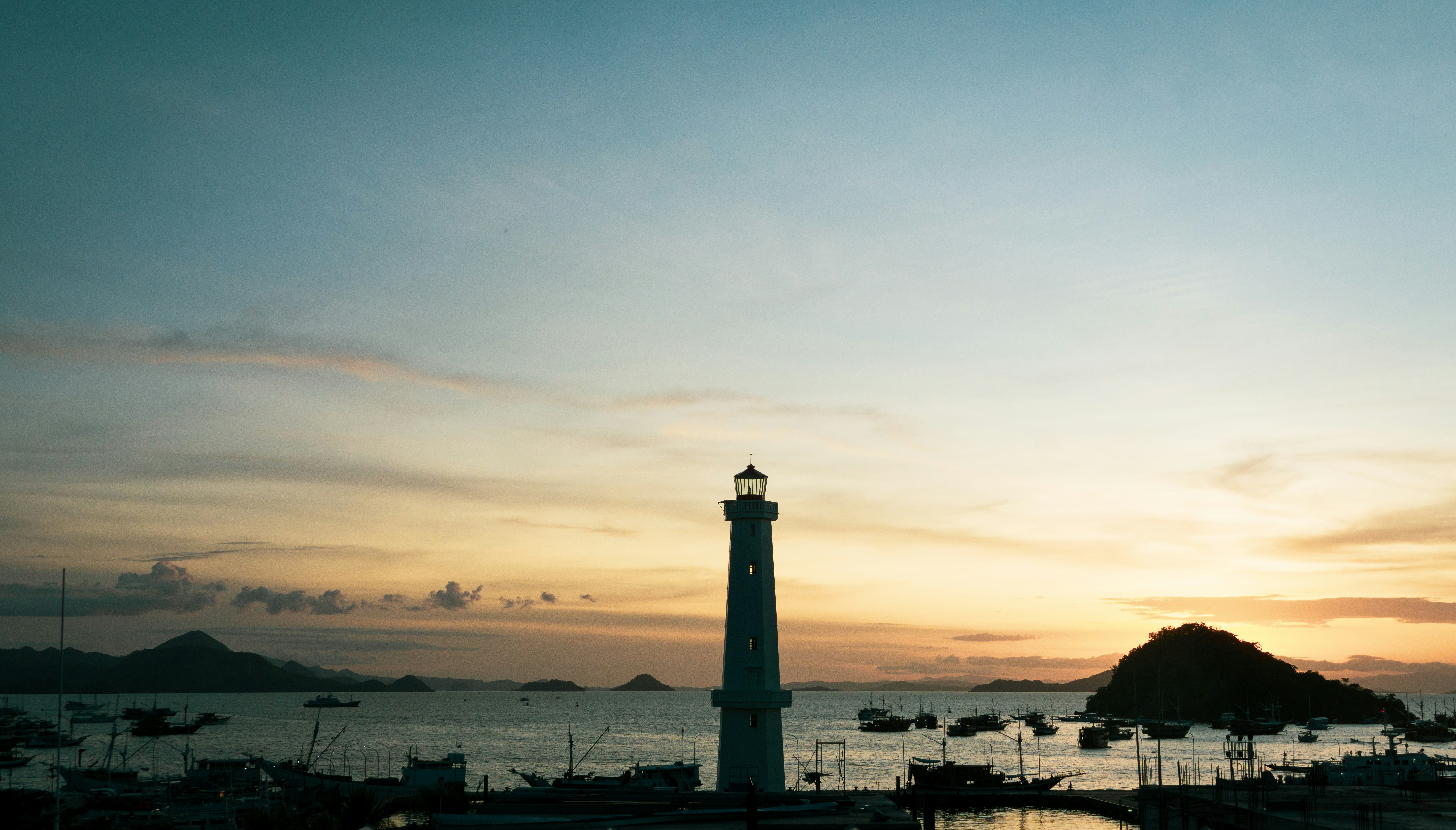 silhouette of lighthouse during sunset