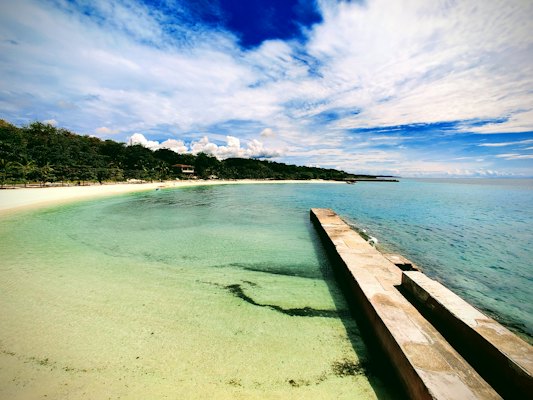 Brown wooden dock on sea under blue sky during daytime — Cebu & Bohol, Philippines