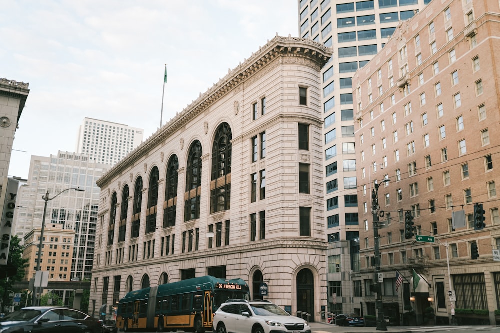 cars parked in front of brown concrete building during daytime