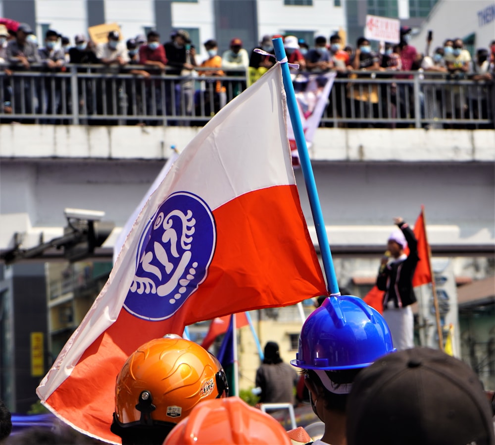 people wearing blue and orange helmet during daytime