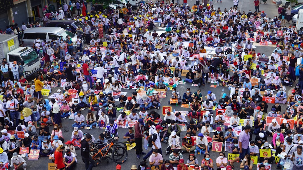 people sitting on black motorcycle during daytime