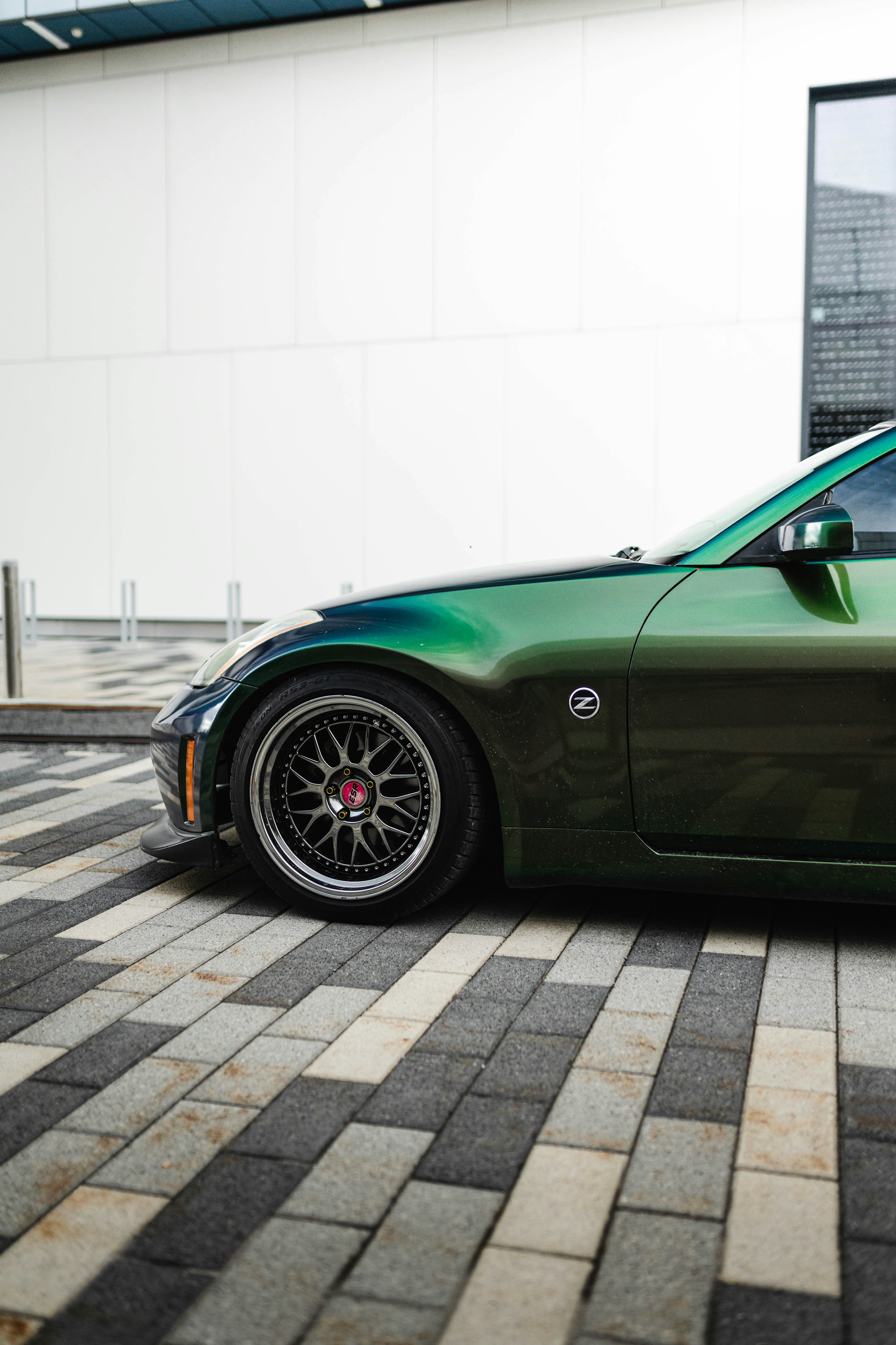 green porsche 911 parked on parking lot during daytime