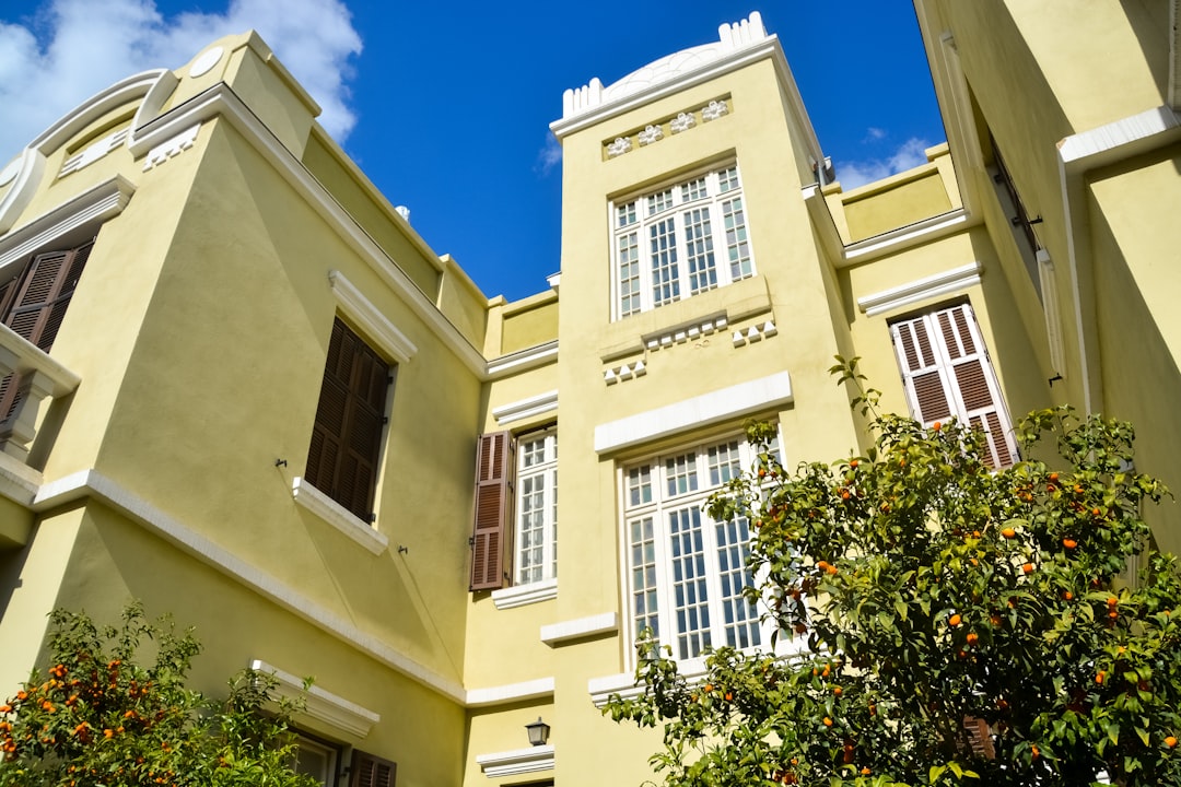 yellow concrete building under blue sky during daytime