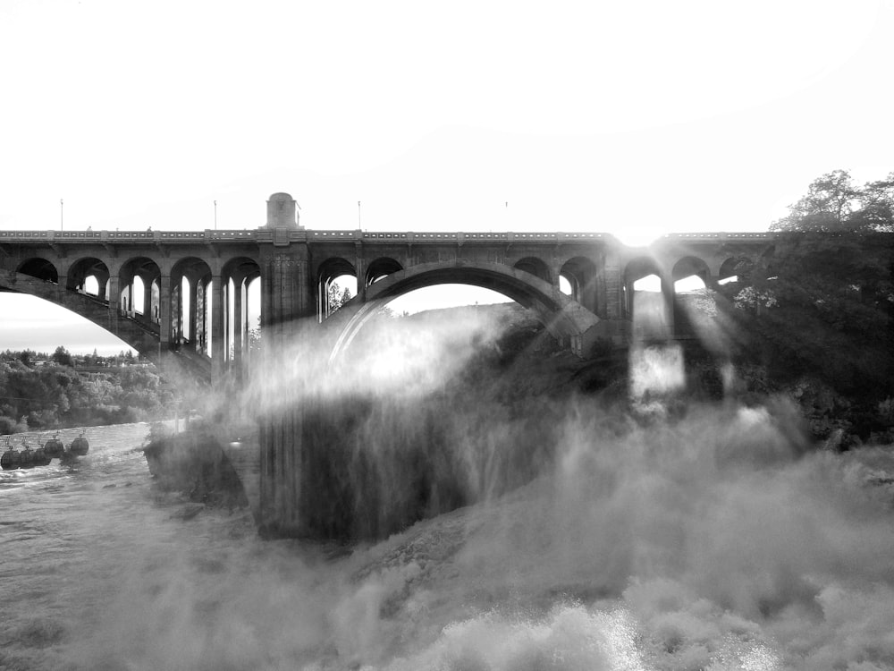 grayscale photo of bridge over water