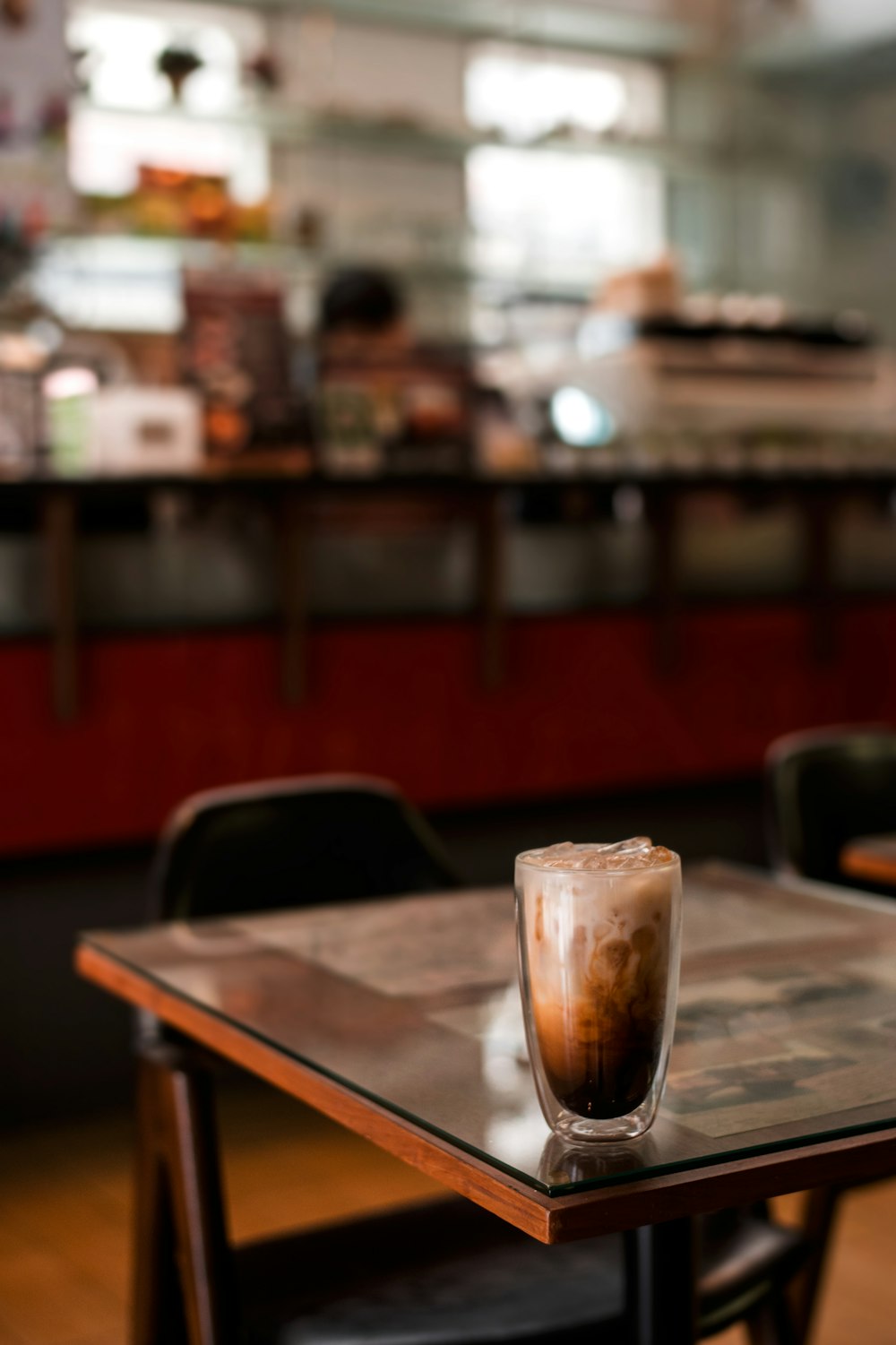 clear drinking glass on brown wooden table