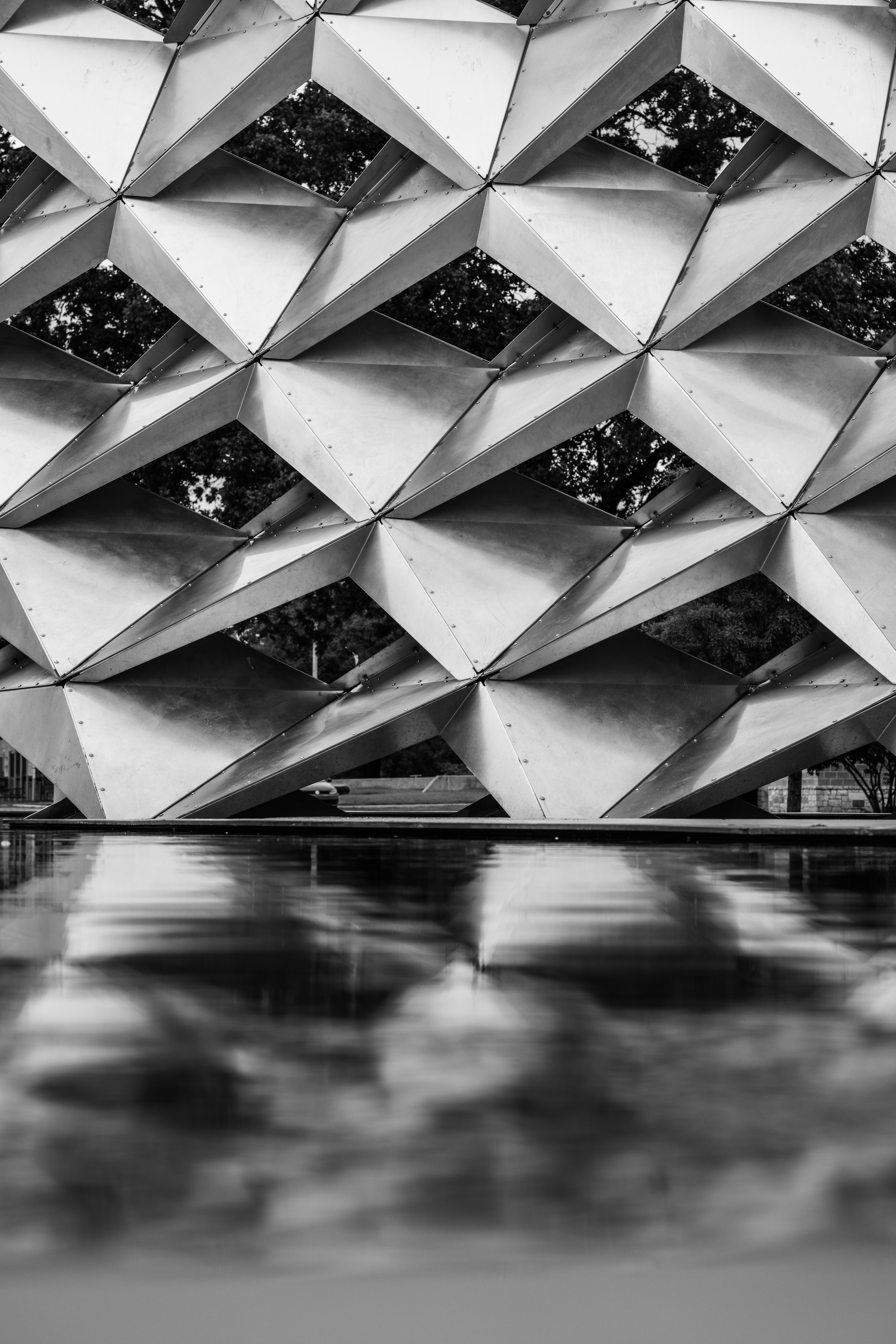 grayscale photo of glass building