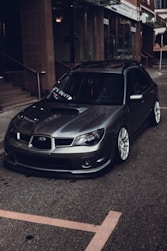 silver bmw m 3 parked on parking lot