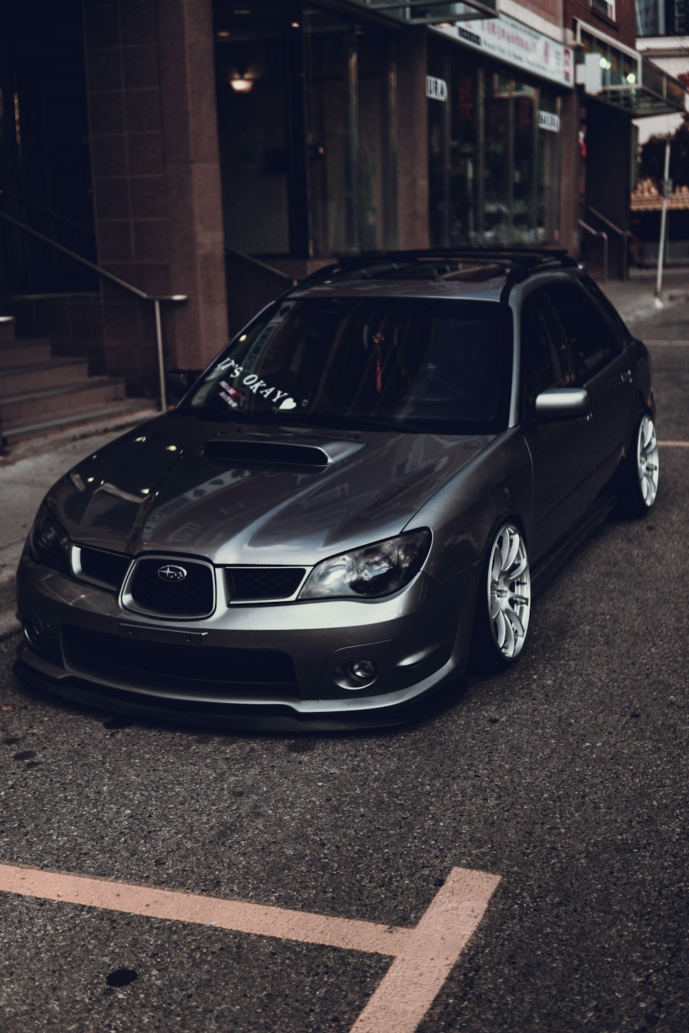 silver bmw m 3 parked on parking lot