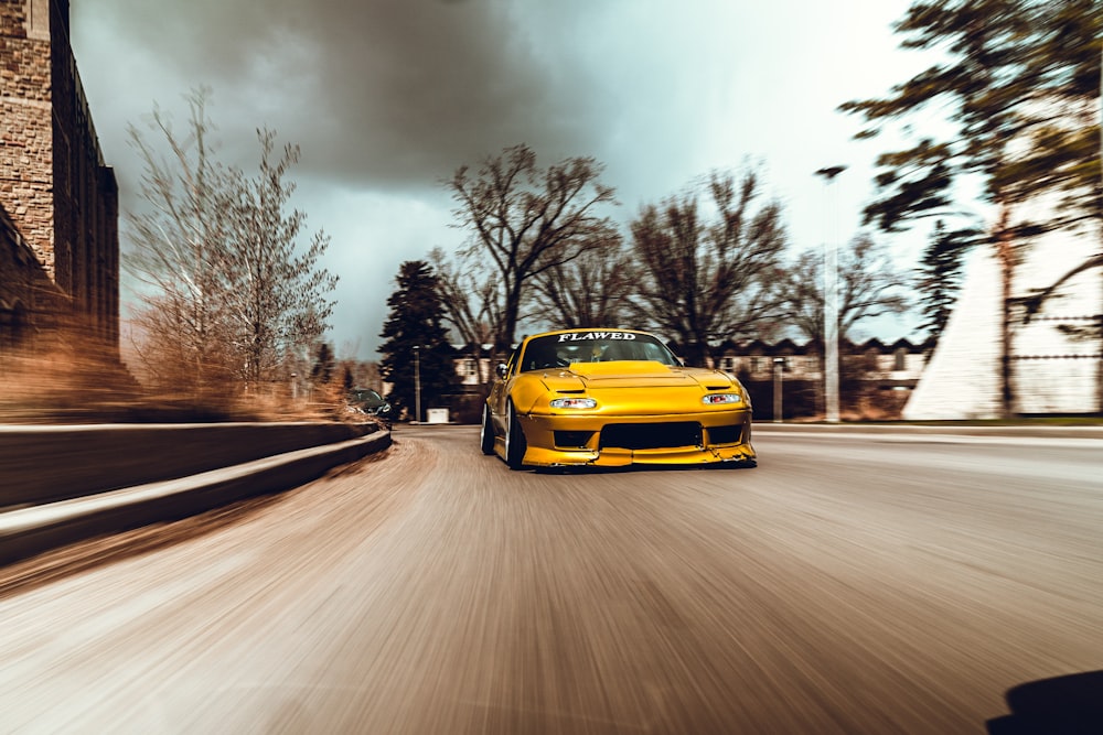 yellow car on road during daytime