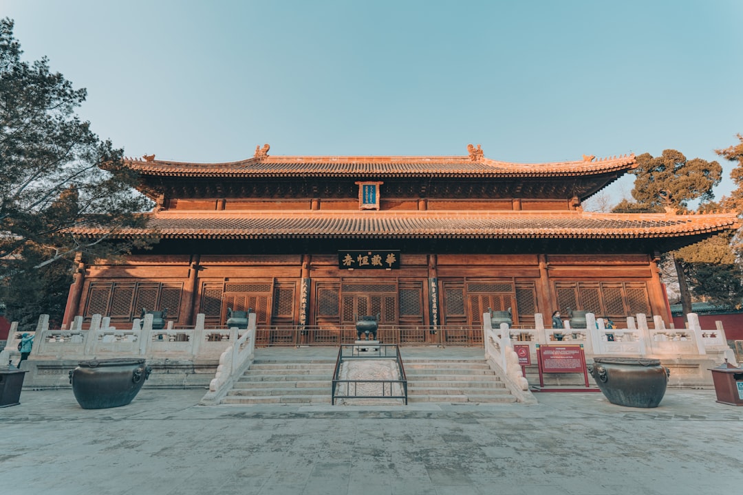 red and brown temple under blue sky during daytime