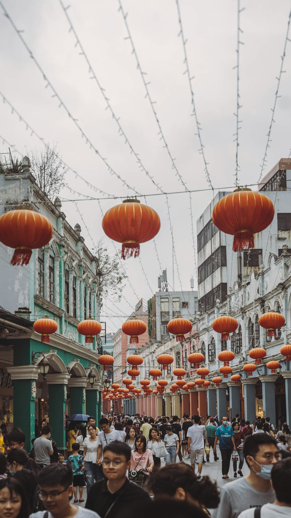 orange paper lanterns on street during daytime