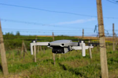 A drone capturing aerial views of a rural landscape.