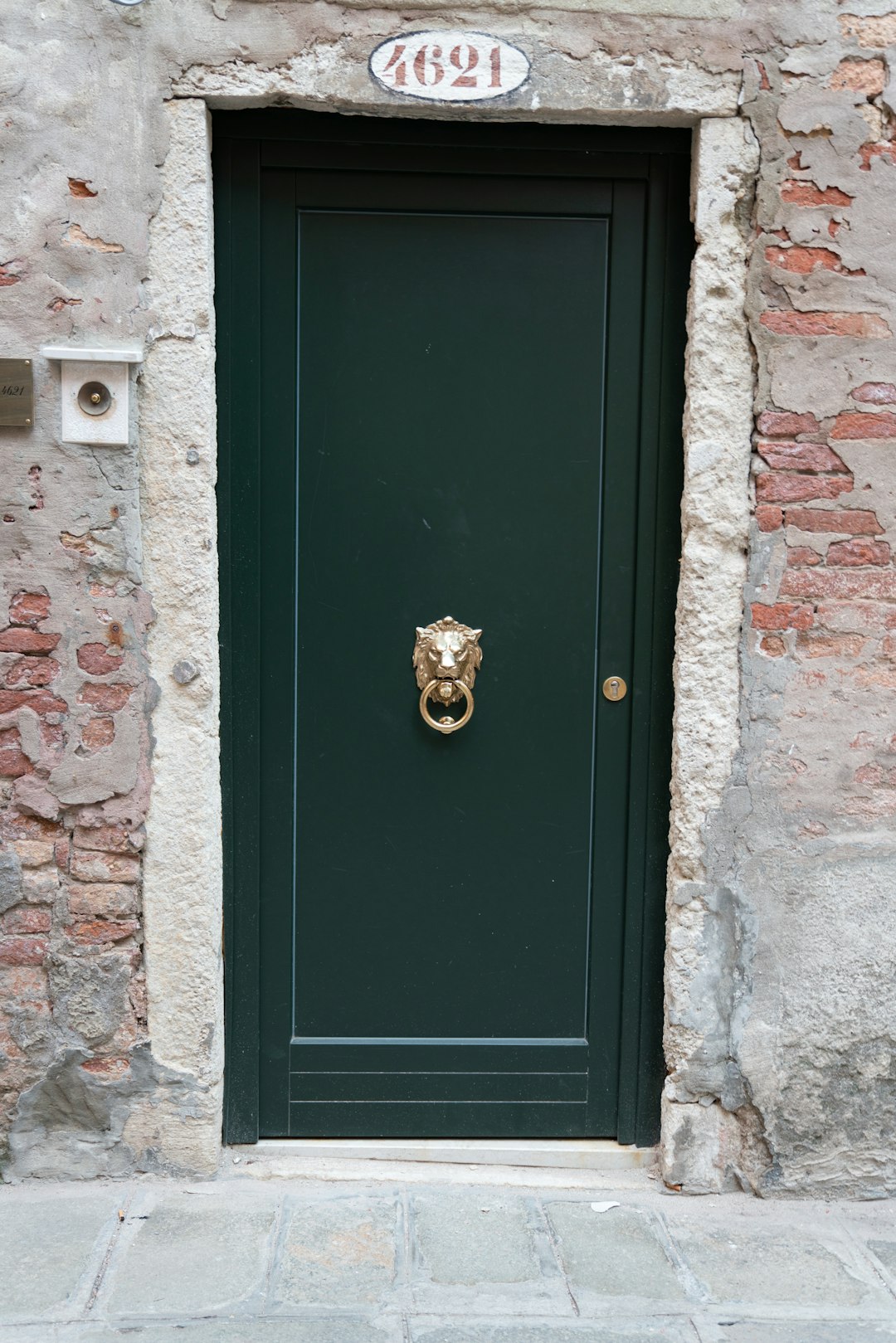 blue wooden door with gold door knob