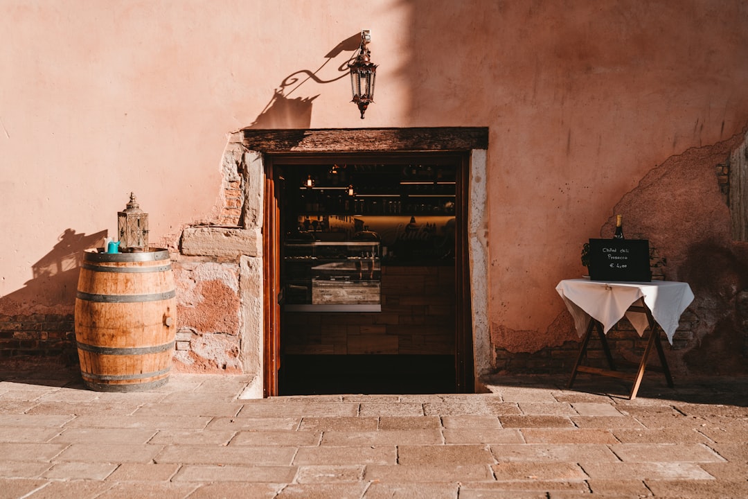 brown wooden door near white chair