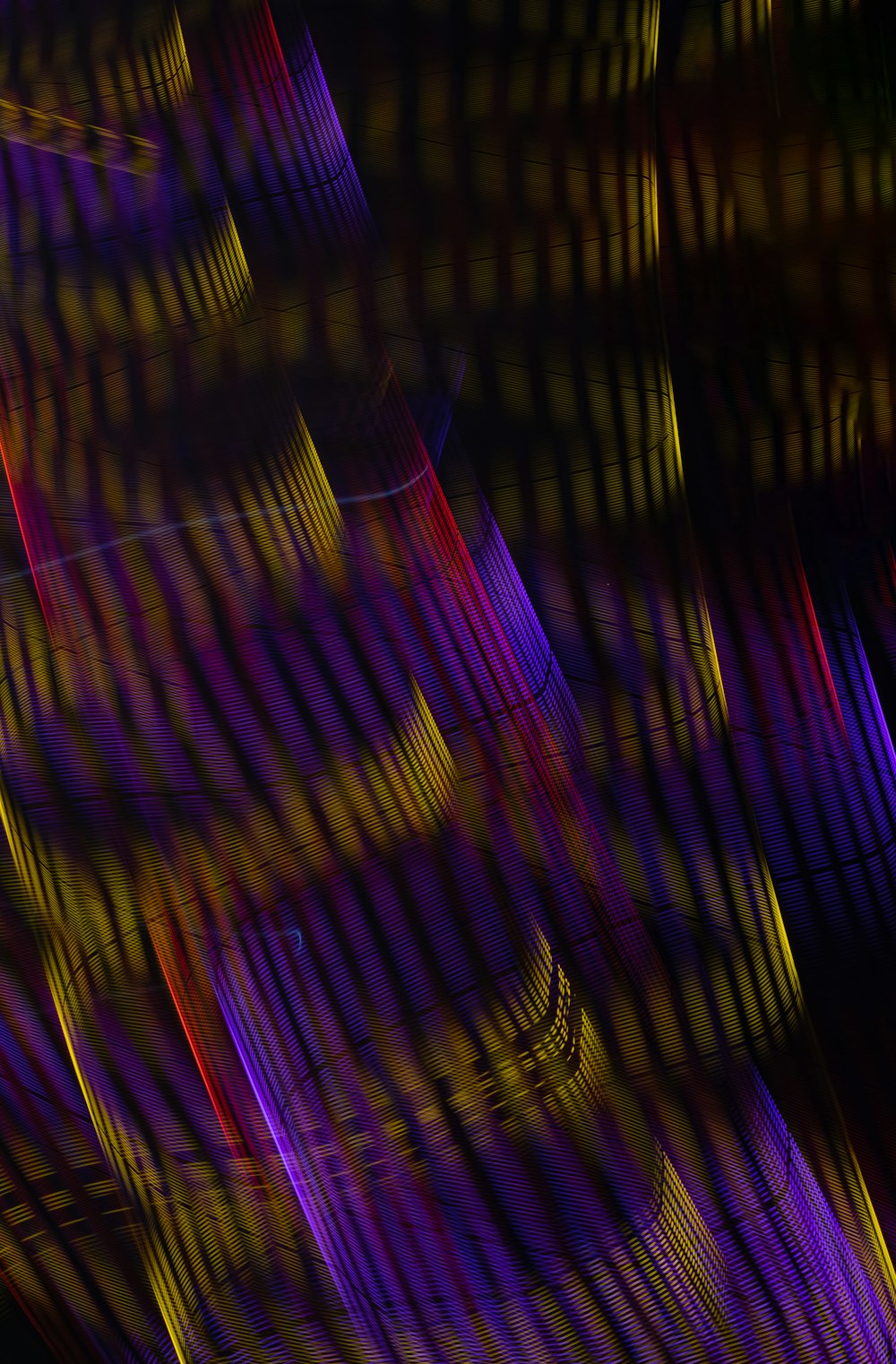 purple and black striped textile