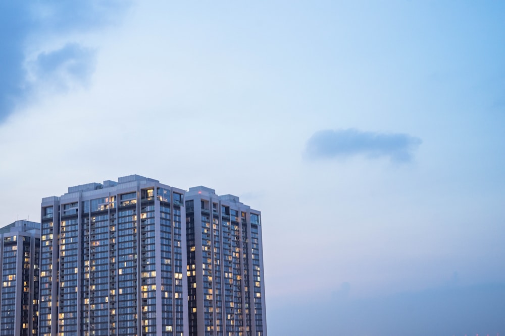 blue and white high rise building under blue sky during daytime