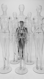 clear glass bottles on white surface