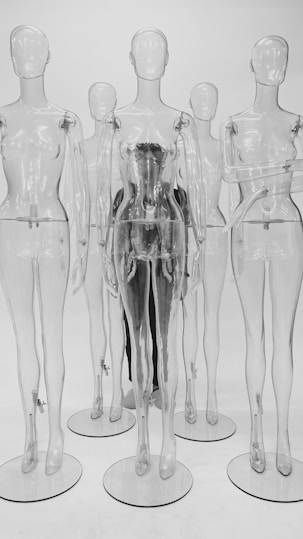 clear glass bottles on white surface