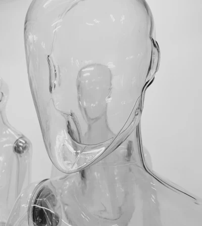 A clear glass mannequin head