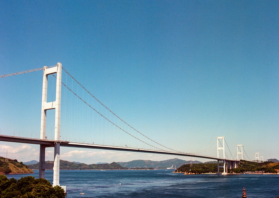 white bridge over blue sky during daytime