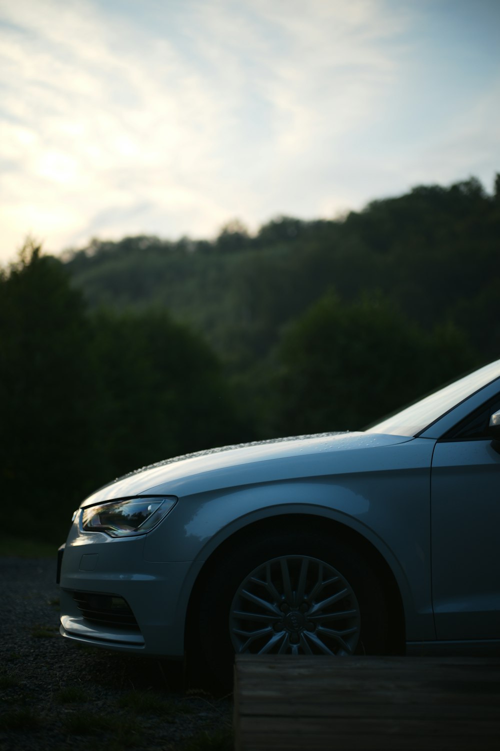 grey car on grey asphalt road during daytime