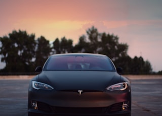 black porsche 911 on road during sunset