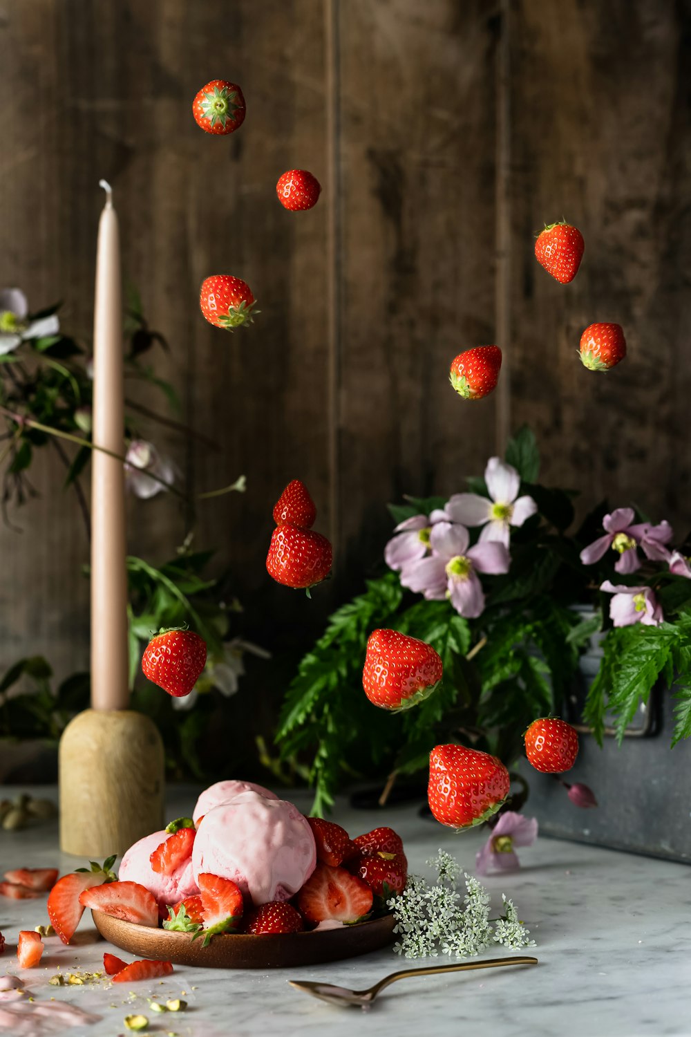 red strawberries on white ceramic plate