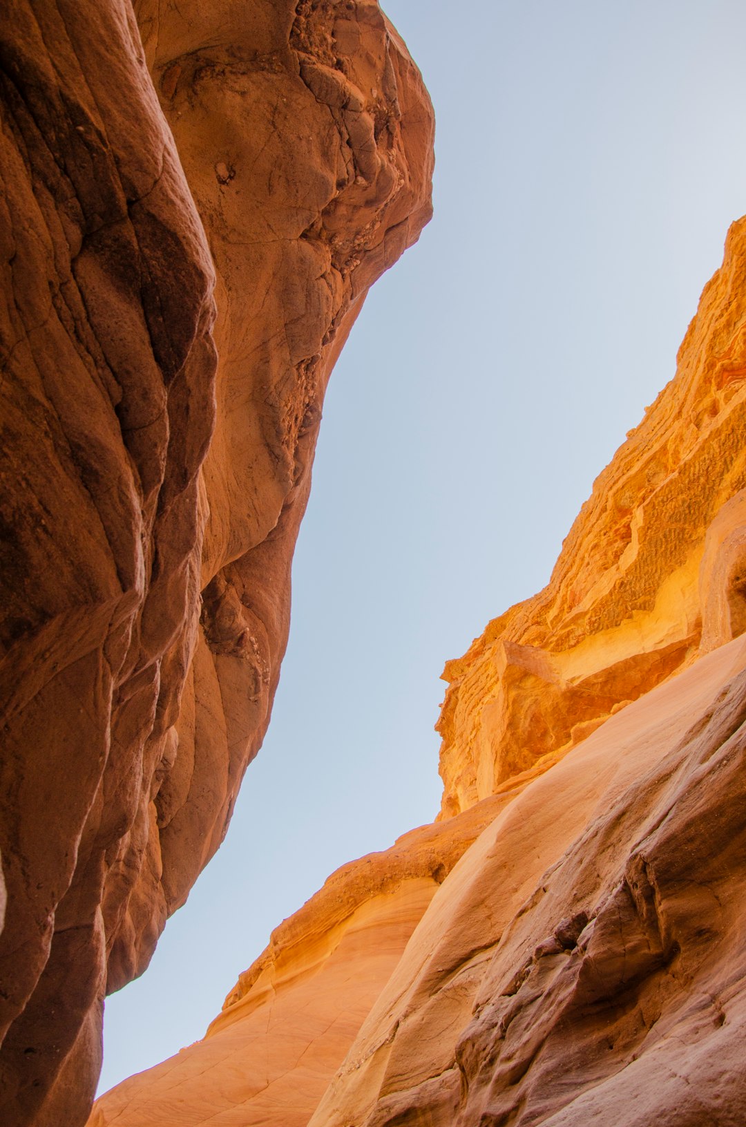 brown rock formation under white sky during daytime