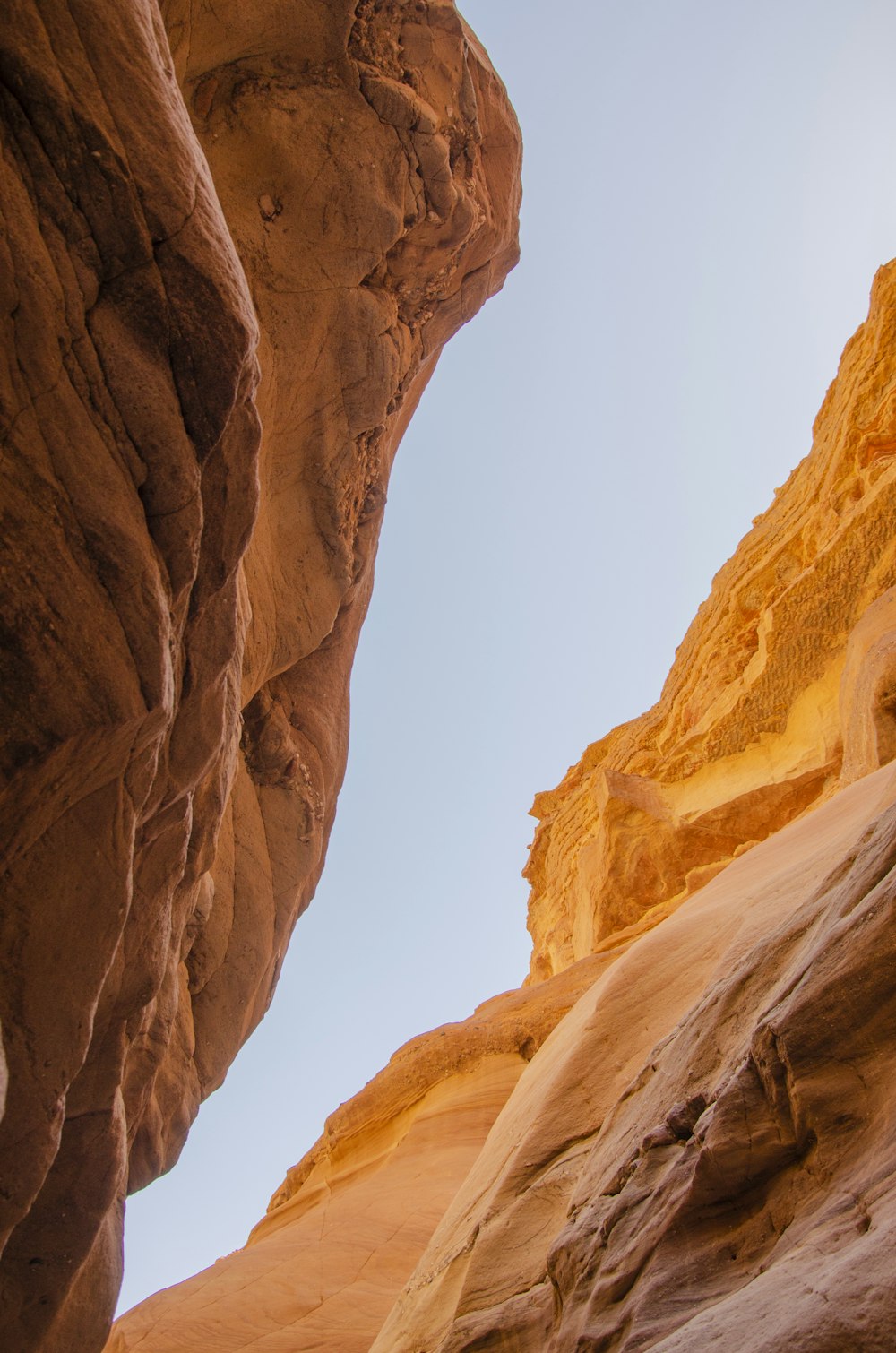 brown rock formation under white sky during daytime