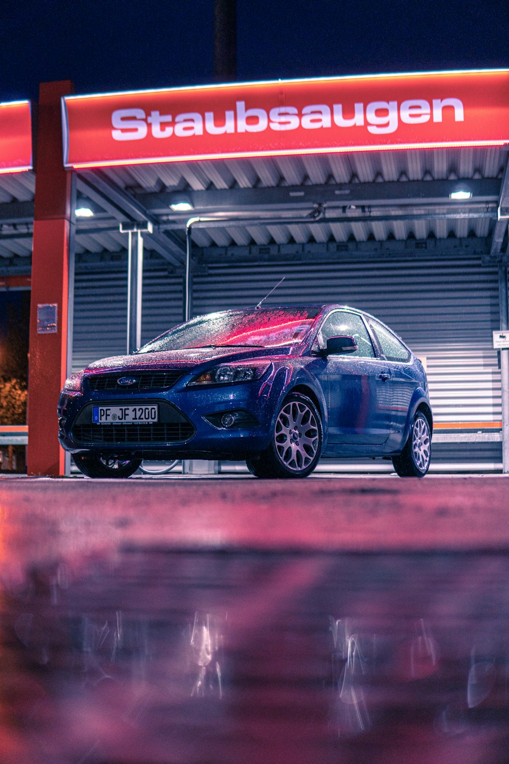 blue honda sedan on road during daytime