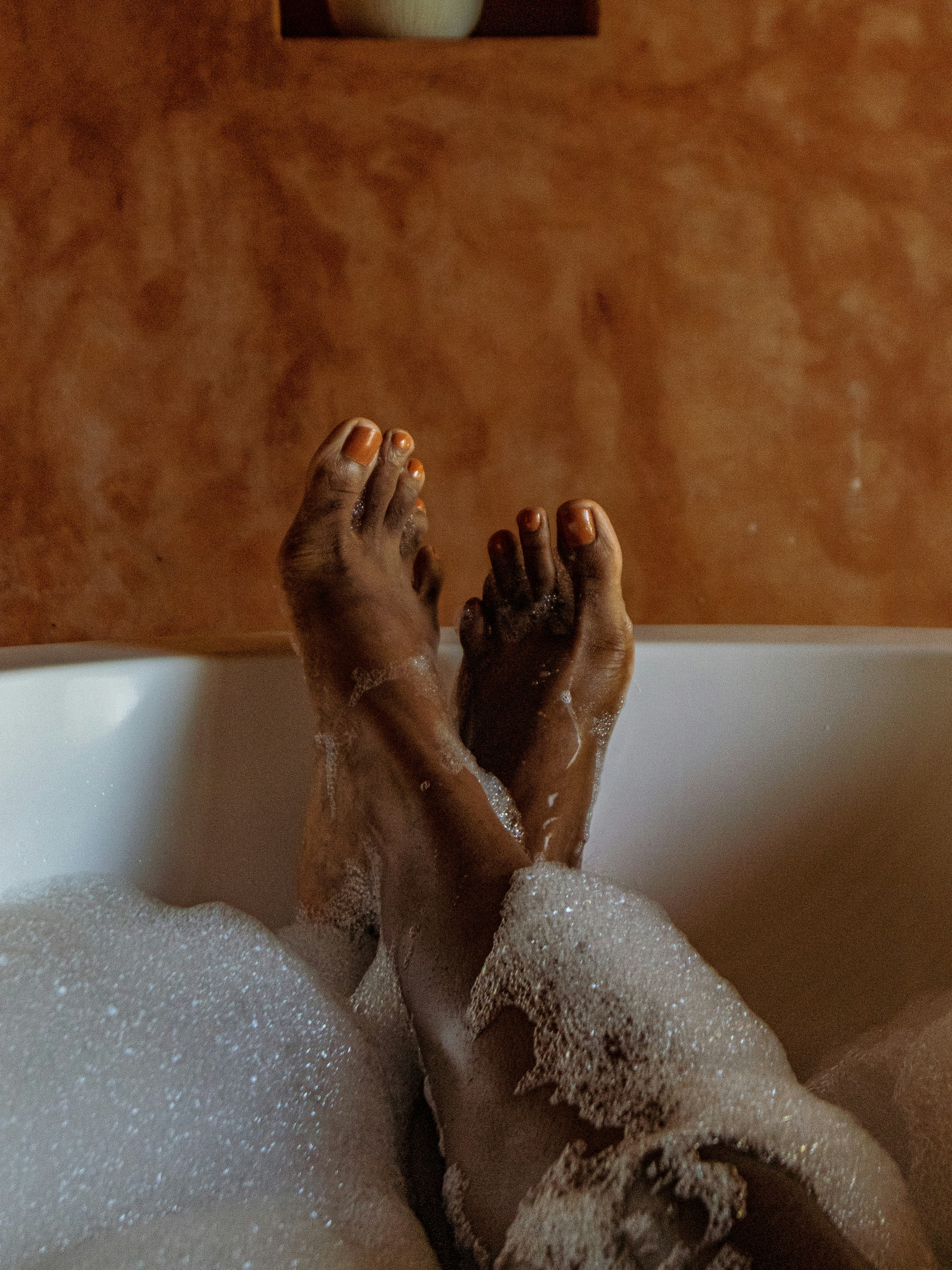 person in bathtub with water